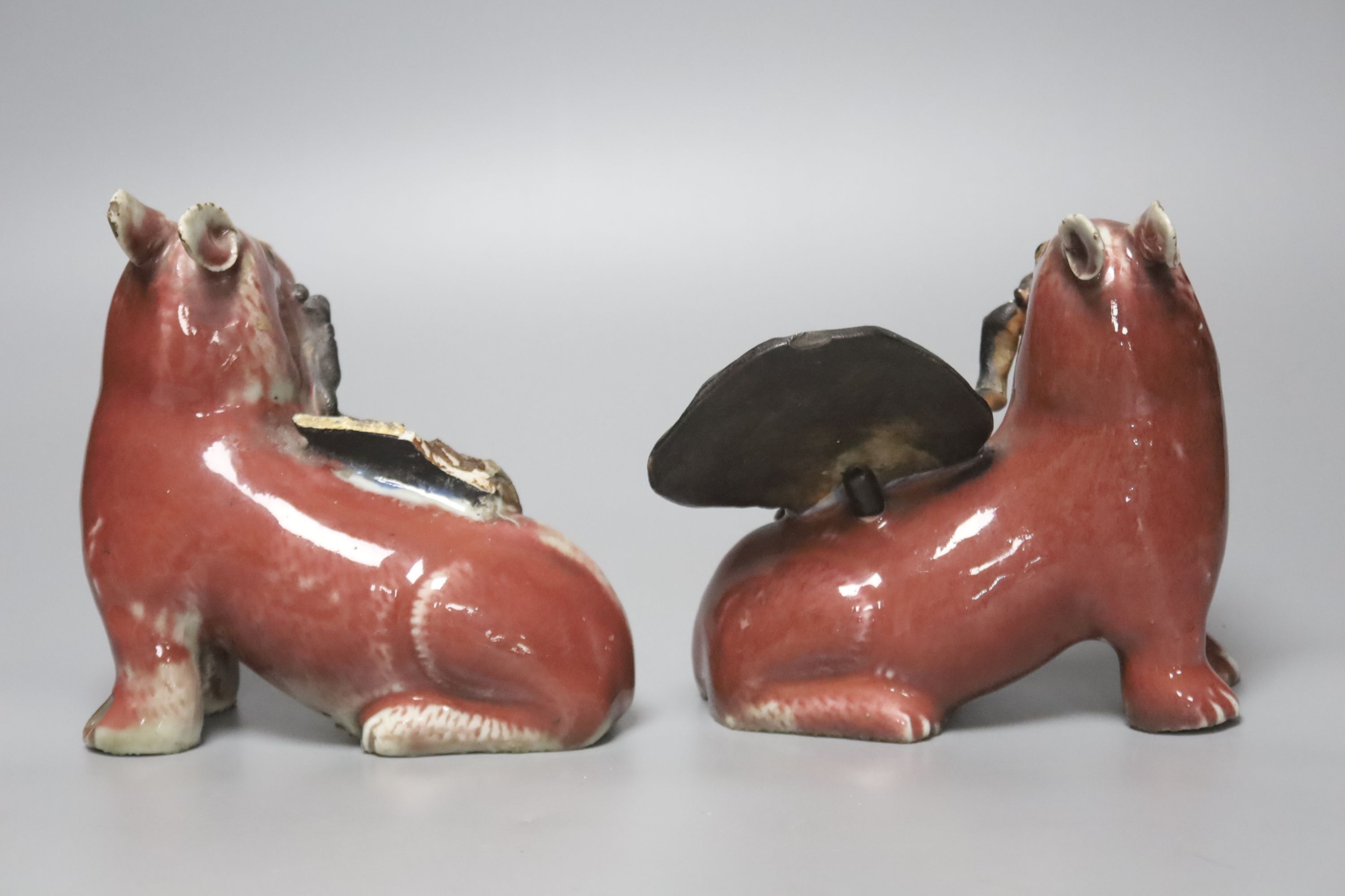 A pair of unusual Chinese copper red glazed pig incense burners/ joss stick holders, late Qing dynasty, height 13cm